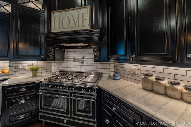 kitchen featuring backsplash, exhaust hood, and double oven range