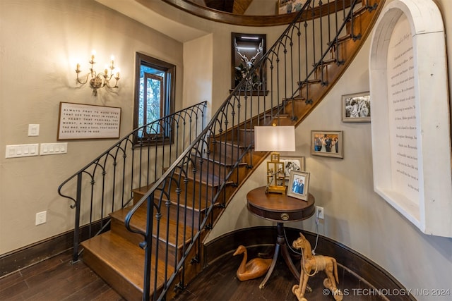 stairs featuring hardwood / wood-style floors