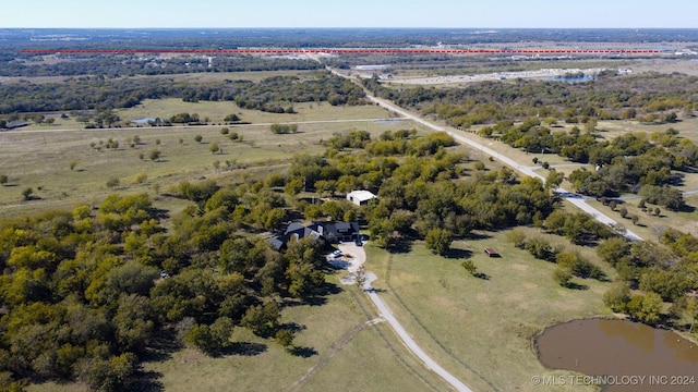 birds eye view of property featuring a rural view and a water view