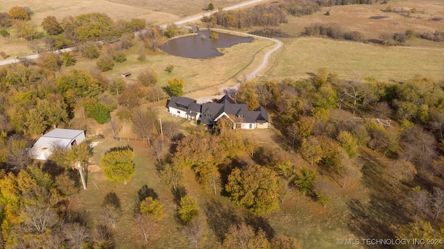 drone / aerial view with a water view and a rural view