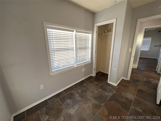 unfurnished bedroom with a closet