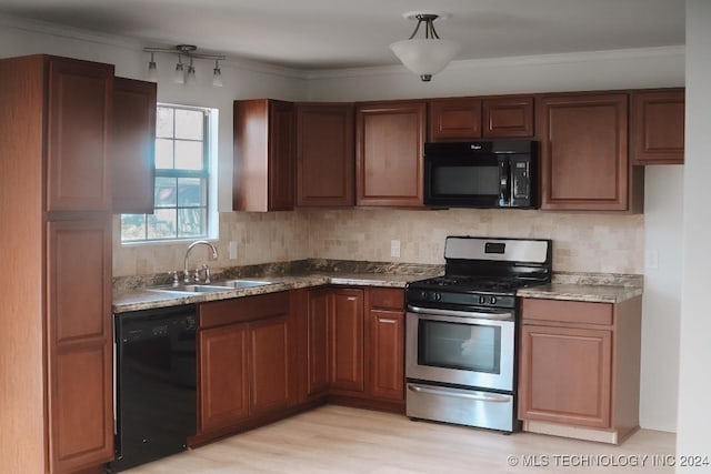 kitchen featuring ornamental molding, sink, black appliances, and light hardwood / wood-style flooring