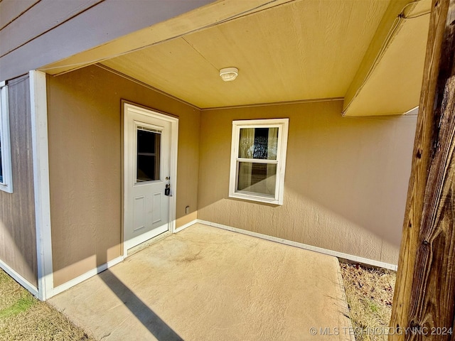 property entrance with a patio