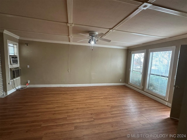 empty room featuring ornamental molding, coffered ceiling, cooling unit, ceiling fan, and hardwood / wood-style flooring