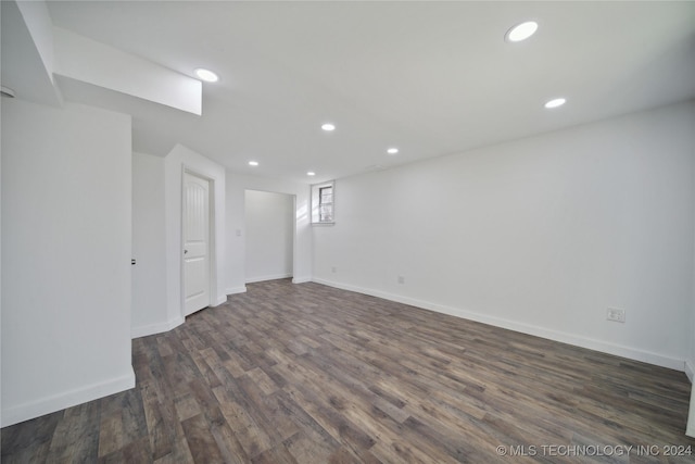 basement with dark hardwood / wood-style flooring