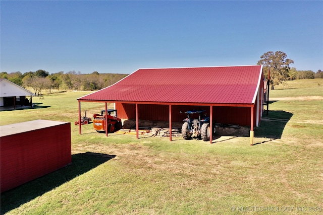 view of outbuilding featuring a lawn