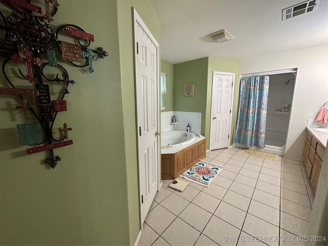 bathroom featuring tile patterned flooring, vanity, and independent shower and bath