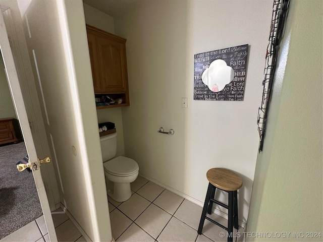 bathroom featuring tile patterned flooring and toilet