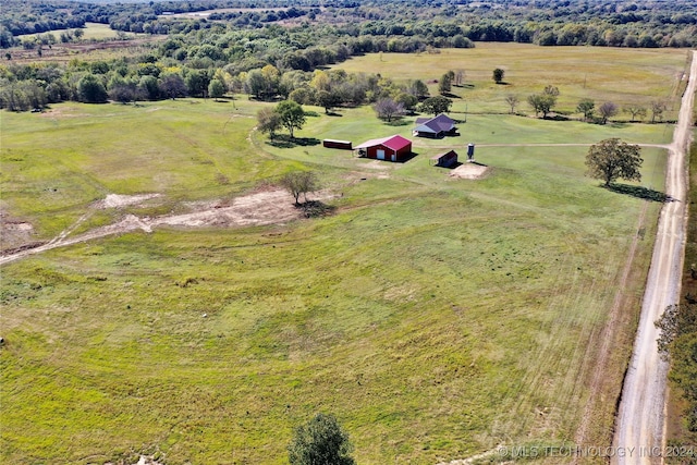 birds eye view of property with a rural view