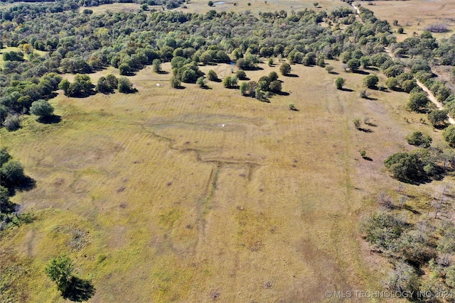 birds eye view of property with a rural view