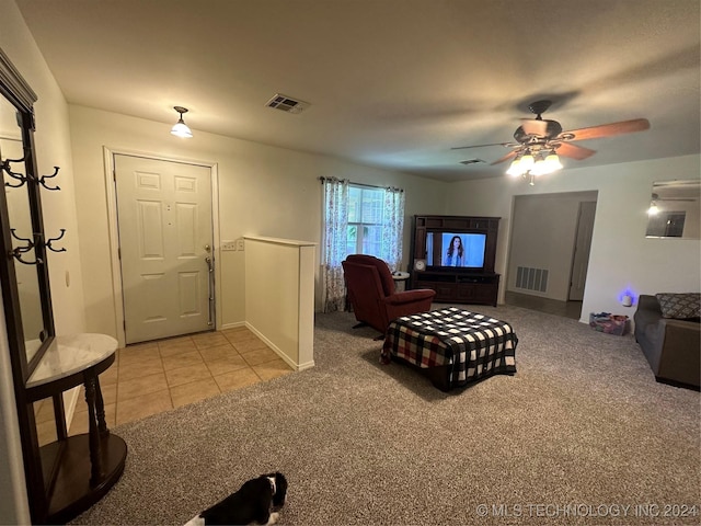 living room featuring ceiling fan and light colored carpet