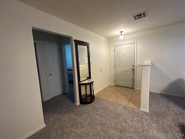 entryway with light carpet