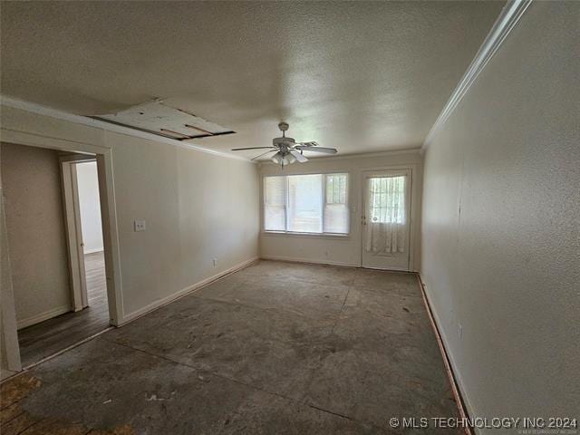 empty room with ceiling fan, crown molding, and a textured ceiling