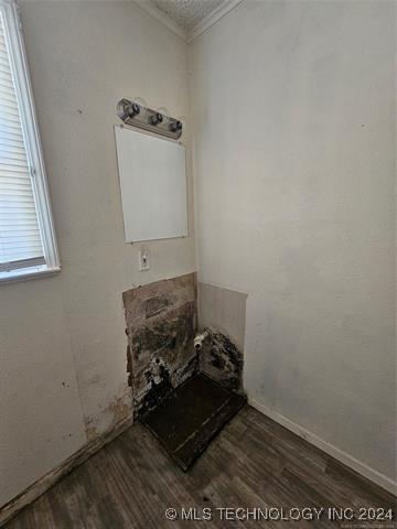 bathroom with hardwood / wood-style flooring