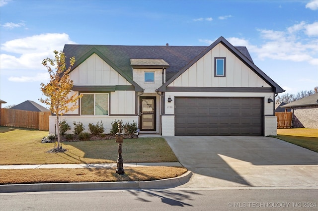 view of front facade with a front lawn and a garage