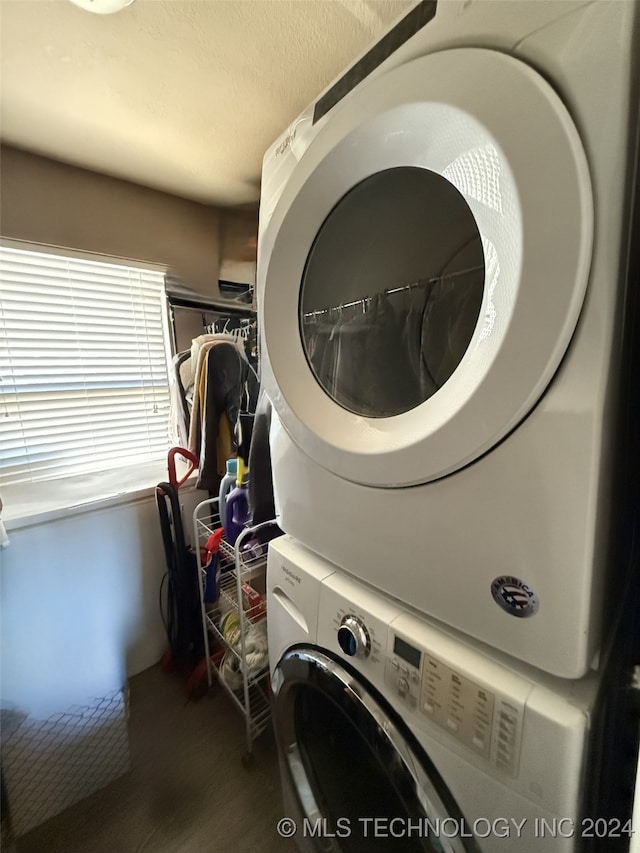 washroom with stacked washer and clothes dryer