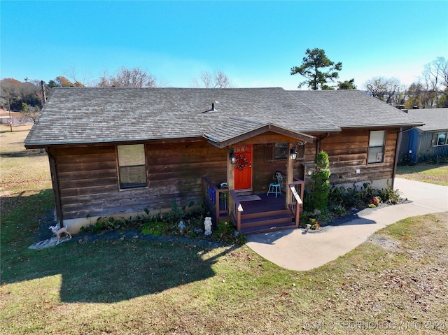121473 S 4159th Rd, Eufaula, OK 74432 - view of front facade with a front lawn, covered porch, and roof with shingles