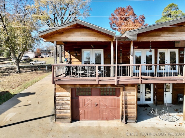 view of front of house featuring a garage and french doors