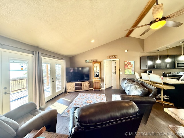 living room featuring ceiling fan, vaulted ceiling with beams, dark hardwood / wood-style floors, a textured ceiling, and french doors