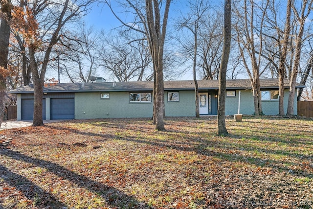 view of front of house with a front yard and a garage