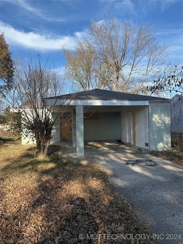 exterior space featuring a carport