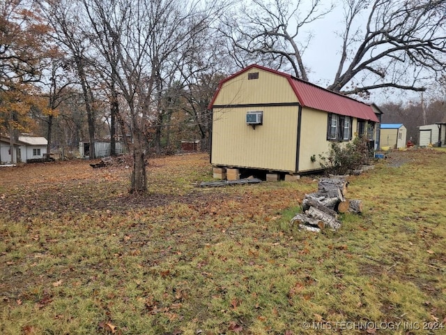 view of yard with a wall mounted air conditioner