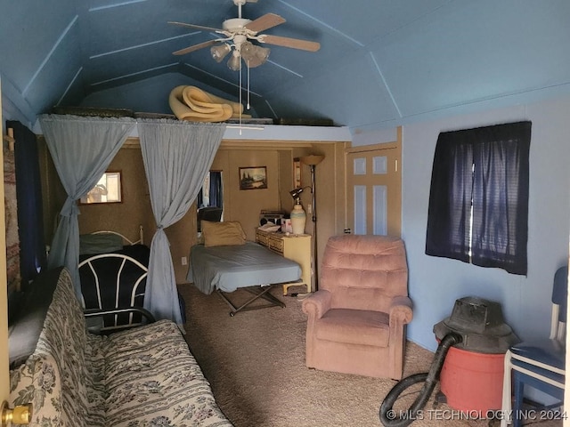 living room featuring ceiling fan, lofted ceiling, and carpet floors