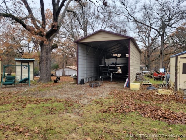 view of outbuilding with a carport