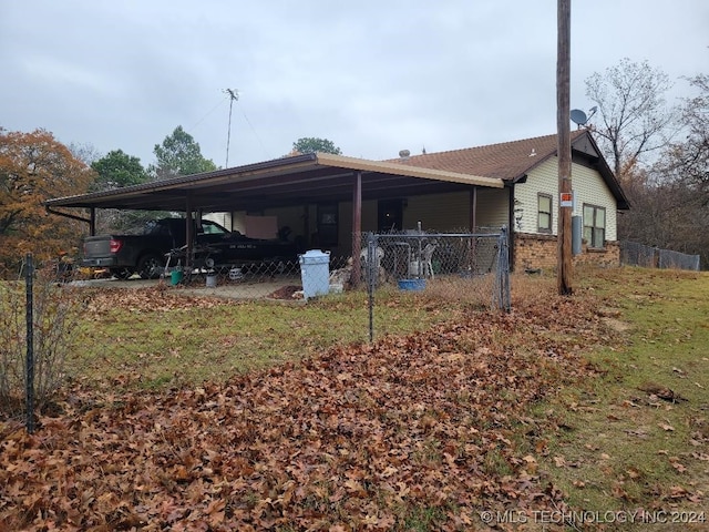 exterior space with a carport