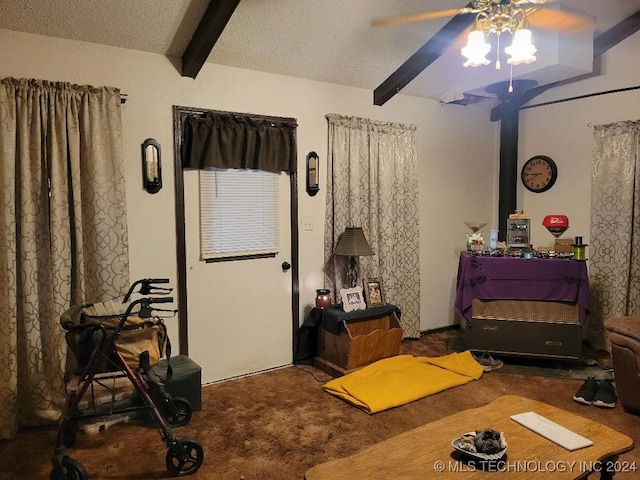 bedroom featuring carpet flooring, beam ceiling, a textured ceiling, and ceiling fan