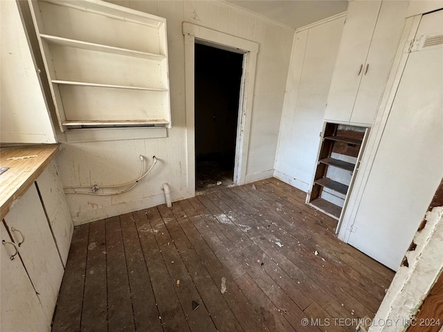 miscellaneous room featuring dark hardwood / wood-style floors