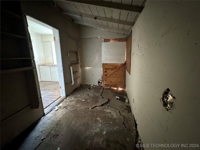 misc room with lofted ceiling with beams and wooden ceiling