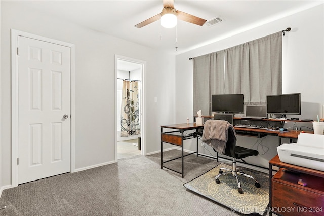 carpeted office with ceiling fan