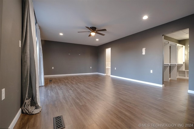 spare room with ceiling fan and wood-type flooring