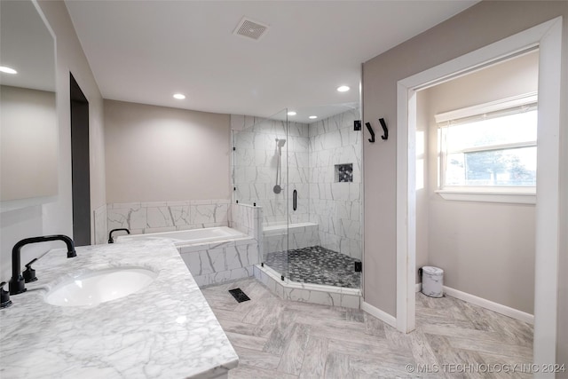 bathroom with separate shower and tub and sink