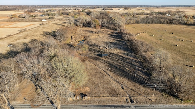 birds eye view of property featuring a rural view