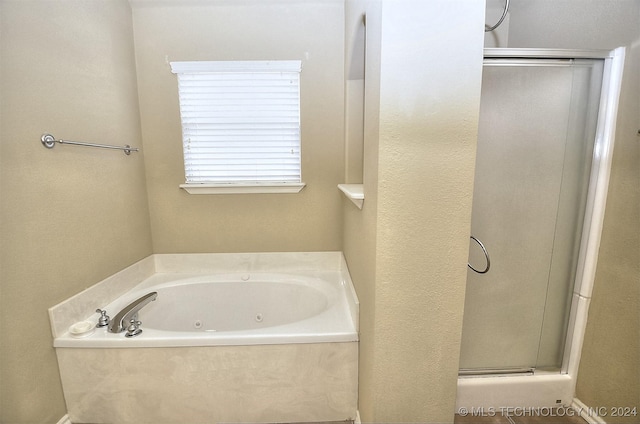 bathroom with shower with separate bathtub