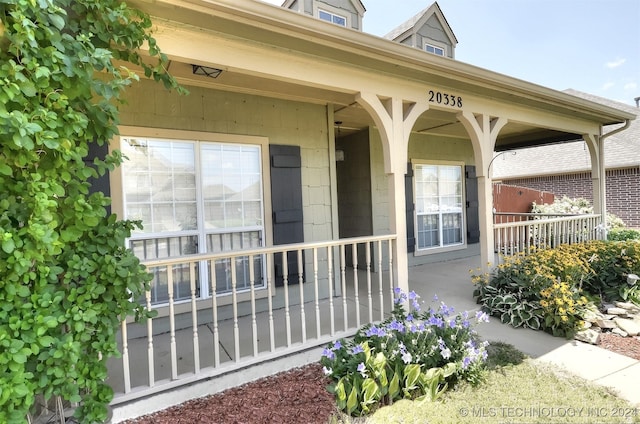 property entrance featuring covered porch