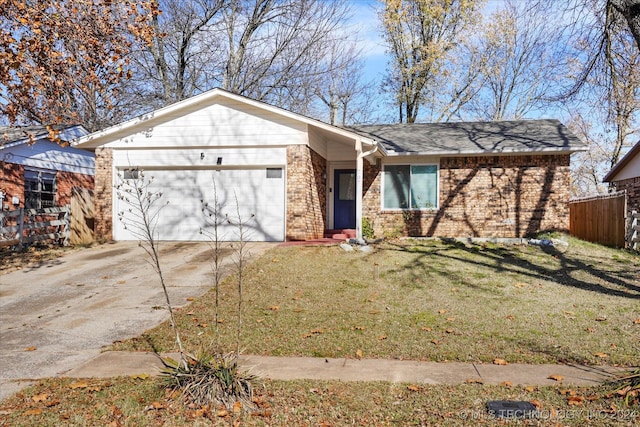 single story home featuring a garage and a front yard