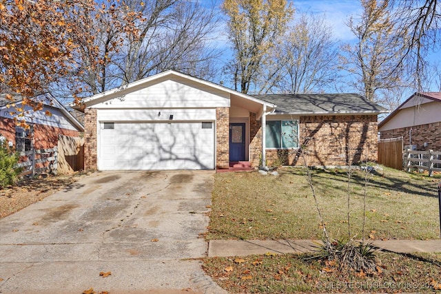 ranch-style house featuring a garage and a front yard