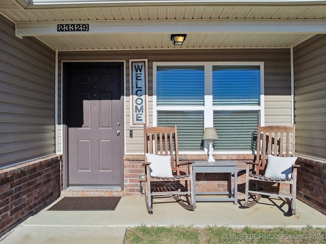 entrance to property with a porch