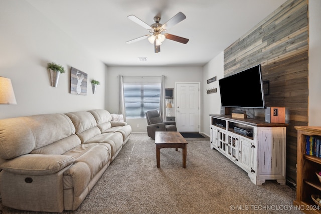 living room with ceiling fan and carpet floors