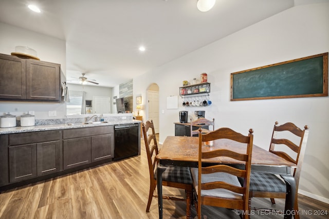 dining area with light hardwood / wood-style floors, sink, and ceiling fan