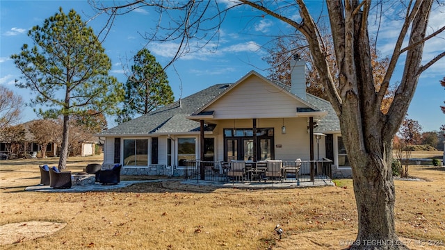 rear view of house featuring a patio area