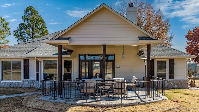 rear view of property featuring a patio area