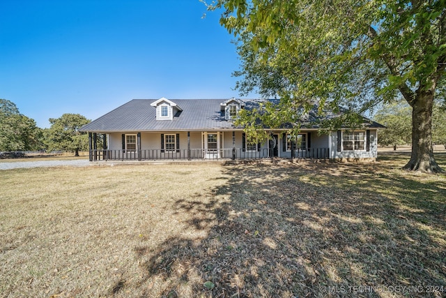 view of front facade with a front lawn and a porch