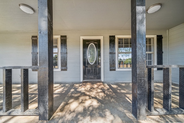 doorway to property with a porch