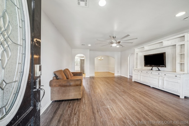 living room featuring ceiling fan and wood-type flooring