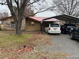 exterior space with a carport