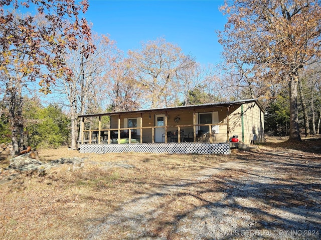 view of front of home with a sunroom